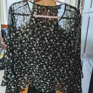 Sheer Summer blouse with tiered sleeves.